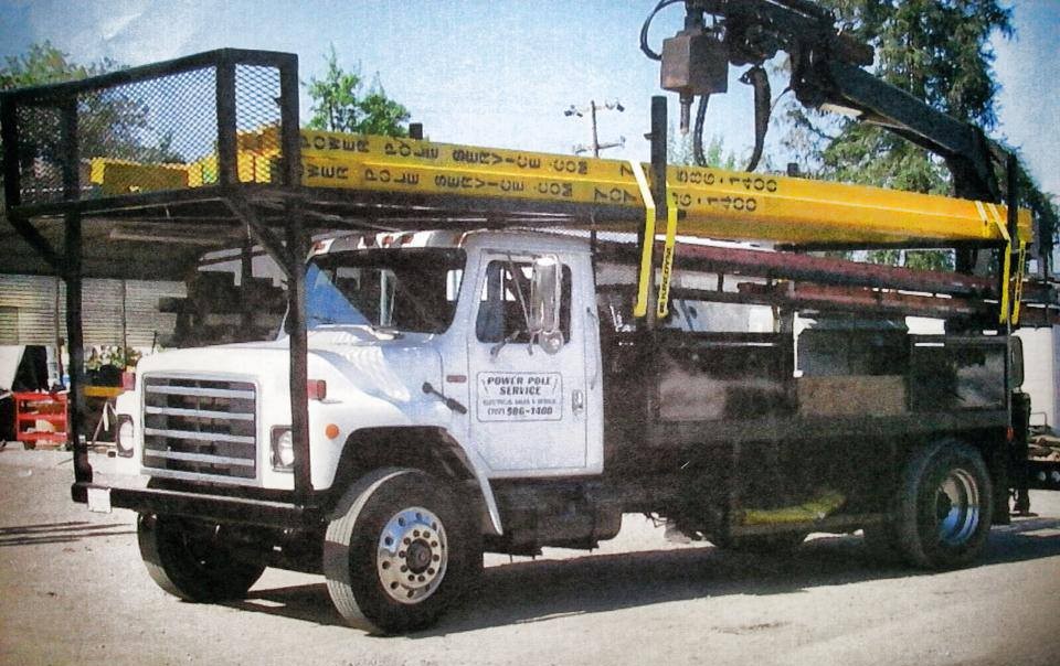 PPS truck carrying power poles